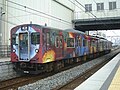 Kakogawa Line 2-car 103–3550 series set M2 with Travel in a galaxy livery by Tadanori Yokoo, February 2006