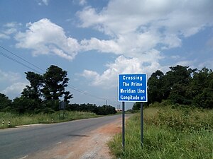 Sign outside Somanya marking prime meridian