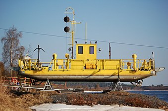 Pikkarala ferry wintering on the shore of Oulujoki.