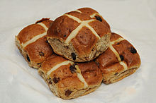 Five buns, each marked with a large X or cross on top