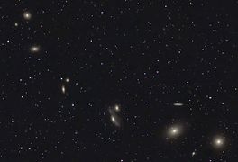 NGC 4402 visible in an image of Markarian's Chain. Click the image then move the cursor over it to reveal the location of NGC 4402.