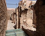 Remains of the triple-arched fountain structure next to the qubba