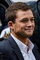 Taron Egerton spricht den Gorilla Johnny