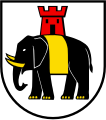 D'argento, all'elefante di nero, allumato del campo, difeso, unghiato e gualdrappato d'oro e sostenente una torre di rosso aperta e finestrata del secondo (Hilfikon, Svizzera)