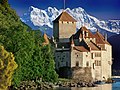 Image 21Château de Chillon, a castle on the north shore of Lake Geneva, against the backdrop of the Dents du Midi (from Alps)