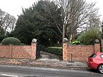 Garden wall and gate piers to The Homestead, No. 25 Woodbourne Road