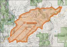 A map of the fire footprint shows it stretching from southwest to northeast on both sides of Highway 299, engulfing both Round Mountain and Montgomery Creek