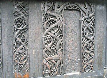 Carvings on door jambs and a wall plank of the north wall