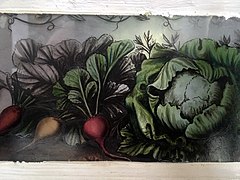 Peinture sur verre sur l'une des portes du château : des légumes