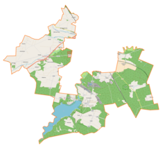 Mapa konturowa gminy wiejskiej Tomaszów Mazowiecki, blisko lewej krawiędzi znajduje się punkt z opisem „Chorzęcin”
