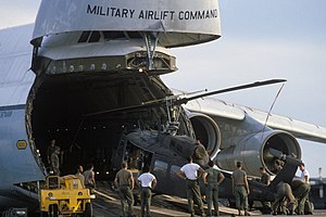 Air_Force_personnel_load_an_Army_UH-1H_Iroquois_helicopter_into_a_436th_Military_Airlift_Wing_C-5A_Galaxy_aircraft_for_transport_to_Ecuador_for_use_in_the_joint_US_and_Ecuadorian_Ex_-_DPLA_-_0e7ac2c1bb6ac4b91aaaf1df7b8412d5