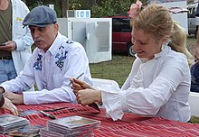 Axelrod and Jim Kweskin autograph CDs at the Kentuck Festival of the Arts (Northport, Alabama, 2015).[1]