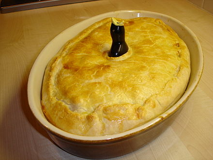 A chicken pie with a traditional pie bird