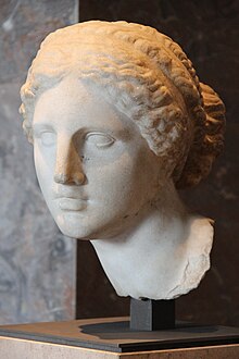 Stone carving of the head of a woman