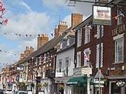 The high-street decorated with bunting and flags