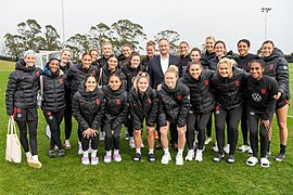 Smith with the U.S. national team and Second Gentleman, Doug Emhoff, July 2023