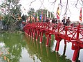 Bridge entering the temple with flags displayed