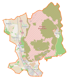 Mapa konturowa gminy Suchy Las, na dole znajduje się punkt z opisem „Suchy Las”