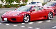 Front three-quarters view of a red sports car