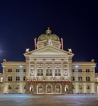 Federal Palace North Facade. Plaza view during full moon with clear night sky.