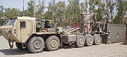 Oshkosh M1075A0 PLS truck fitted with the Armor Holdings developed protection package