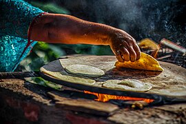 Cooking tortillas on a hot griddle