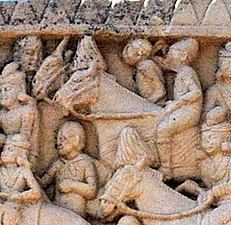 Foreigners on horses, wearing headbands, caps and boots. Western gate of Stupa 1.