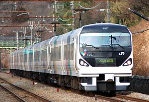 White train with black front and colorful sides