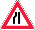 Road narrows on left side