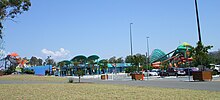 An overview of WhiteWater World from Dreamworld's entrance showcasing (from left to right) The BRO, park entrance, Green Room, and Super Tubes Hydrocoaster.
