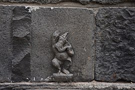 A Ganesha idol carving on the stone wall