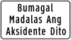 Bumagal, madalas ang aksidente dito (Slow down, accident prone area)