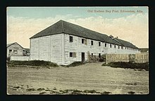 View of the Fort Edmonton buildings. Fences are broken, paint is peeling off the old buildings. Circa 1912.