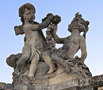 Towards the castle: children with flowers. Springtime.