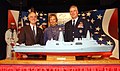 Chairman of the Joint Chiefs of Staff General Richard B. Myers, his wife Mary Jo, and Secretary of the Navy Gordon R. England pose next to a model of USS Somerset