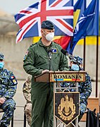 RAF Air Commodore wearing a forage cap with a flight suit in 2021