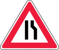 Road narrows on right side