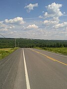 Route 298 climbs hills near Saint-Charles-Garnier.