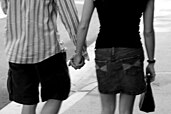 Male and female couple holding hands