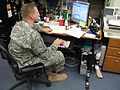 This US officer has three artificial legs, one for walking, one for running and one with an army boot.