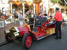 A red turn-of-the-20th-century-style fire engine