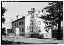 Two-story white house from the side