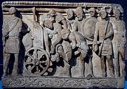 Menelaosz és Mérionész szekérre emelik Patroklosz holttestét (etruszk urna a Kr. e. II. századból)