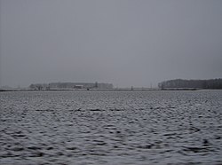 Snow-covered fields and woods in western Greene Township