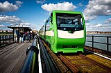 A new Severn Lamb-built train runs along the pier railway towards Pier Head Station in April 2023.