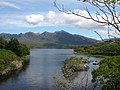 The wastern end o Loch Assynt wi Quinag in the distance