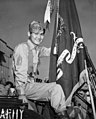 First Sergeant Thomas S. Harimoto displaying the 442nd's colors carrying the unit's Presidential Unit Citation