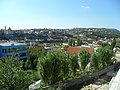 The Skanderbeg tomb in Lezhë with the fortress of Lezhë and some residential houses in the background