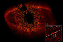 A large red disc around the star Fomalhaut A.