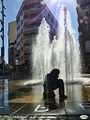 The Children's Fountain with the buildings of the square in the background